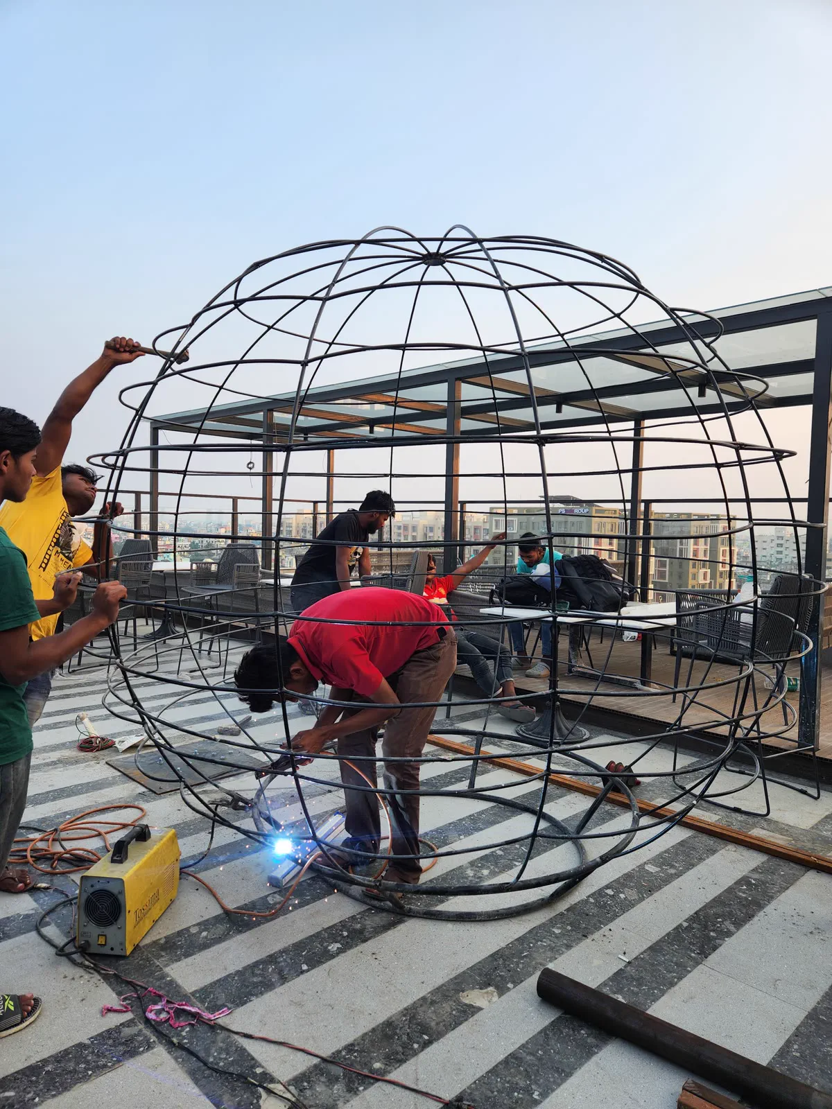 The balloon frame being assembled on the roof