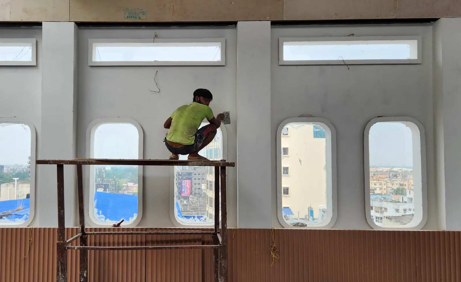 Aerosky under construction — the walls under plaster and the rooftop structure going up