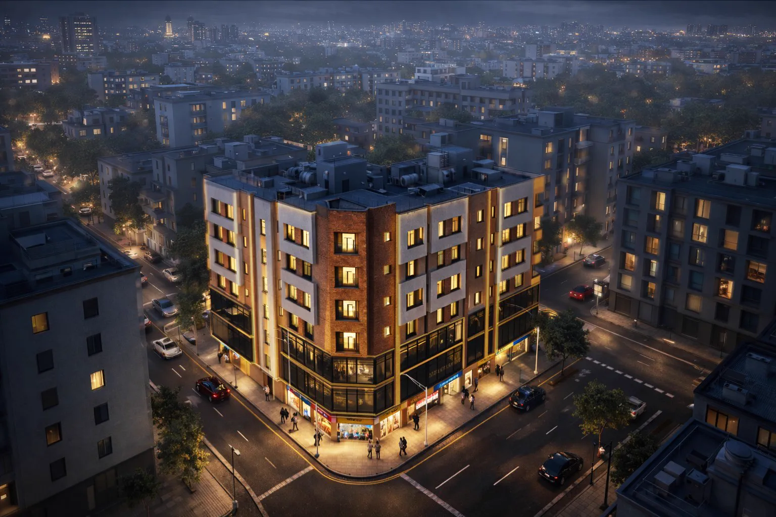 Aerial view of the building on its corner plot at night