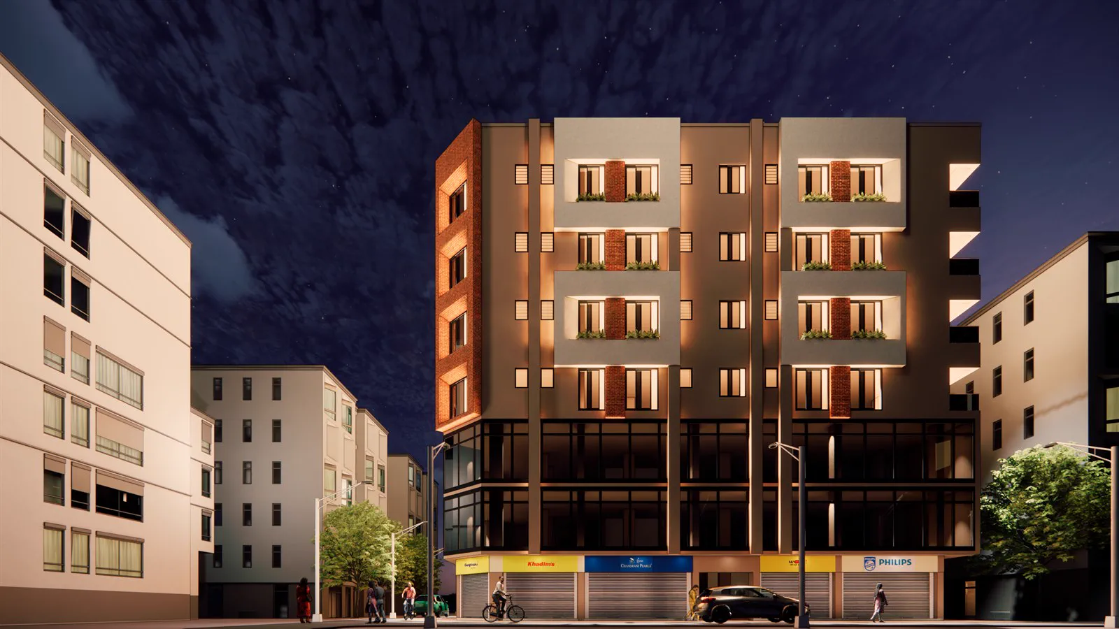 The side elevation at night, showing the recessed balconies and brick reveals