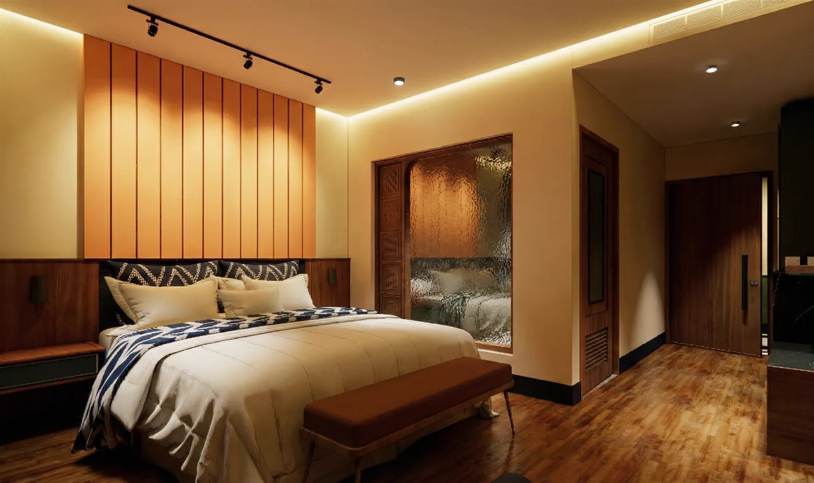 A garden facing room with a carved timber door and reeded glass to the bathroom