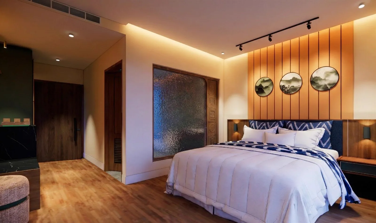 A room seen from the bathroom side, with the carved door and circular artworks
