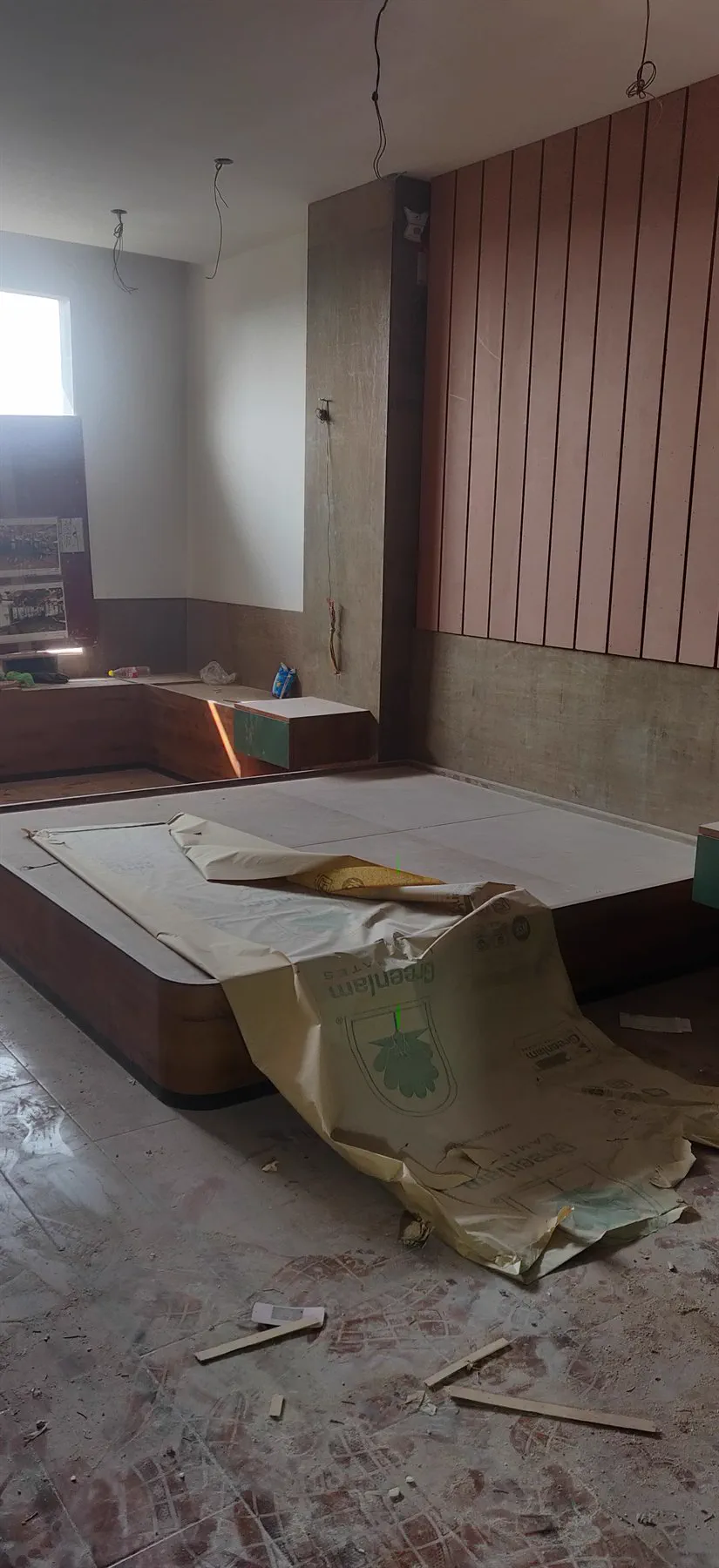 The fluted bed panel part-installed in a city-side room