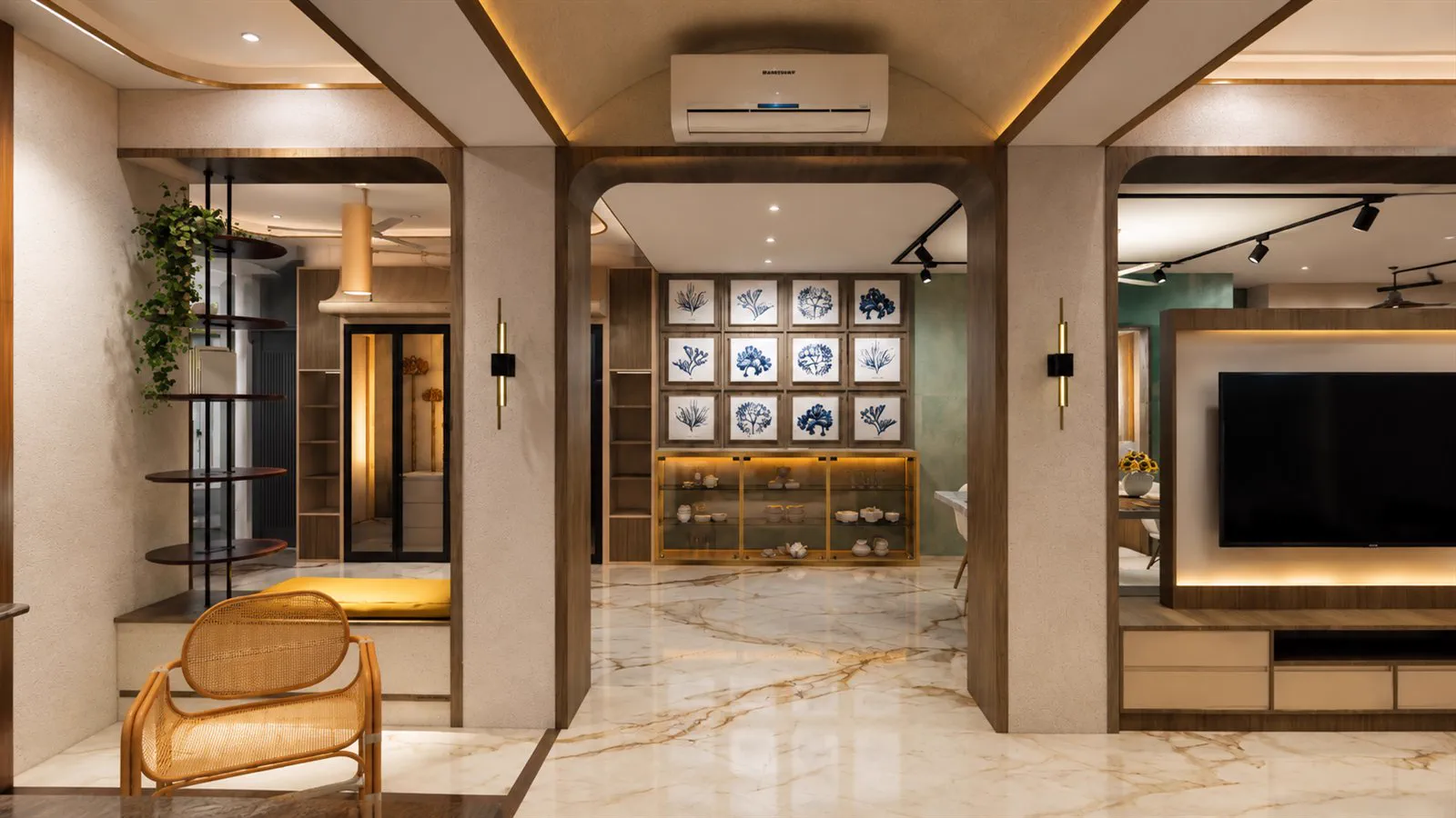 The living room seen on entering, with arched openings and a grid of botanical prints
