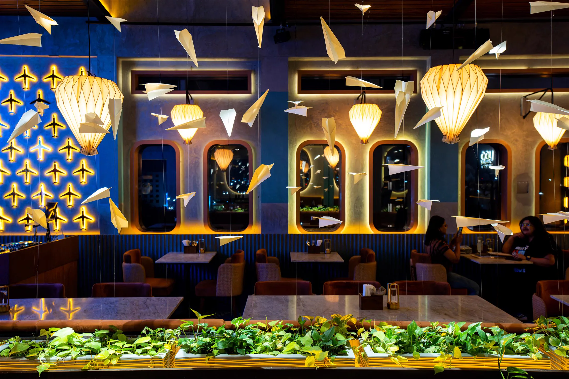 Aerosky Bar & Kitchen, origami paper planes suspended above the dining room