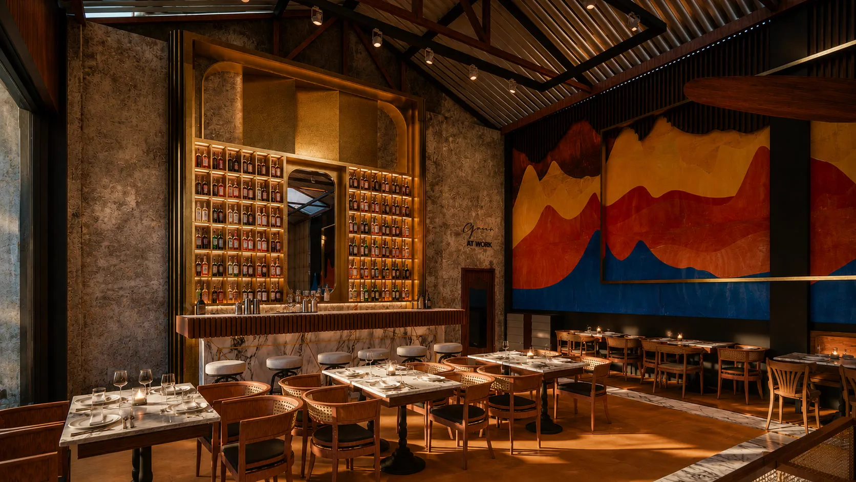The bar backdrop, a backlit brass grid of bottles around an arched mirror above a marble bar