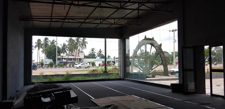 The raw concrete shell looking out to the highway through unglazed openings